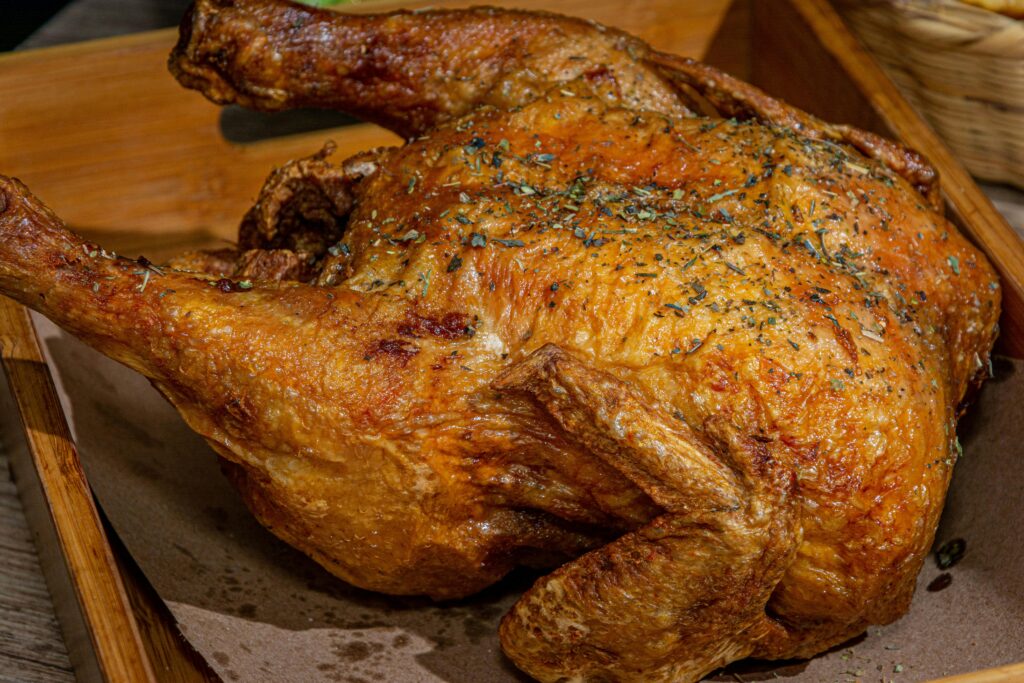 Deliciously roasted chicken seasoned with herbs, perfect for a hearty meal.
