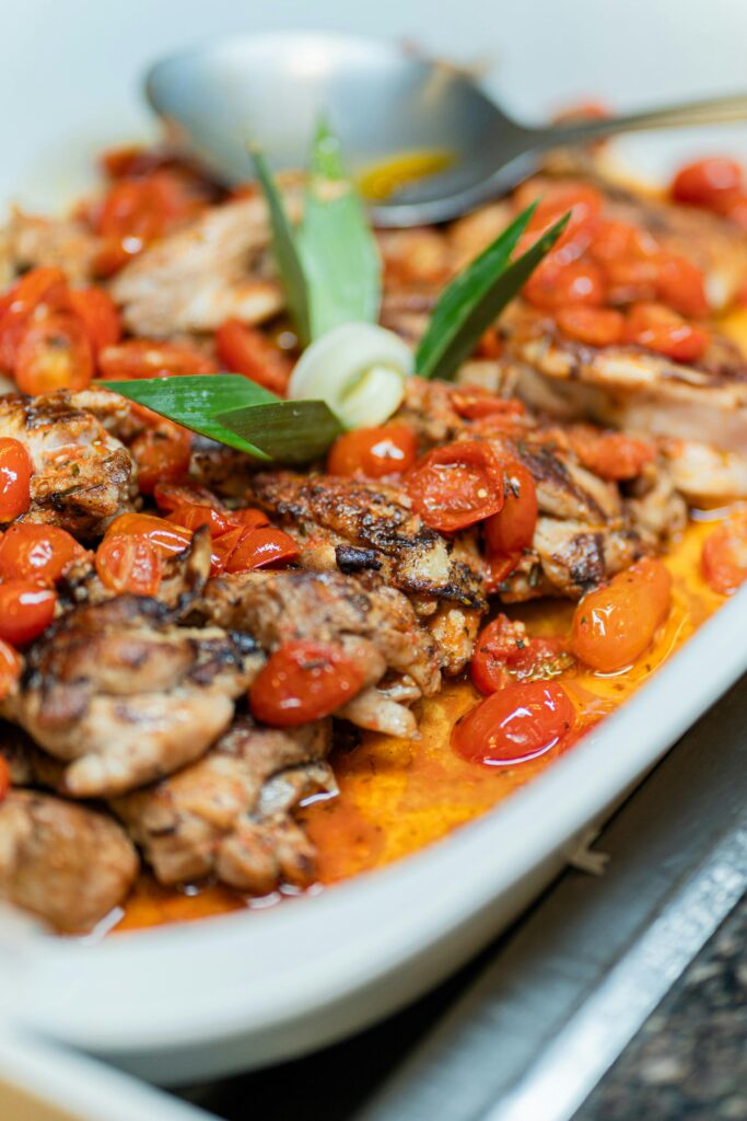 Savor the flavors of roasted chicken with juicy cherry tomatoes in a rich sauce.