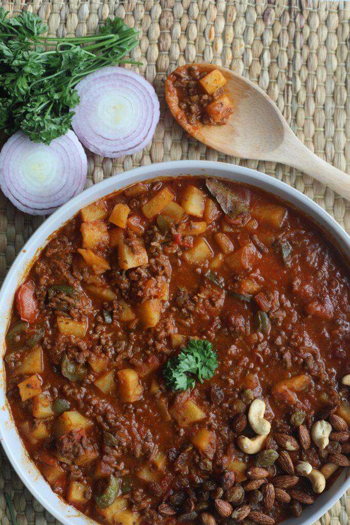 A delicious Malaysian stew with potatoes and nuts, captured in a top view shot.